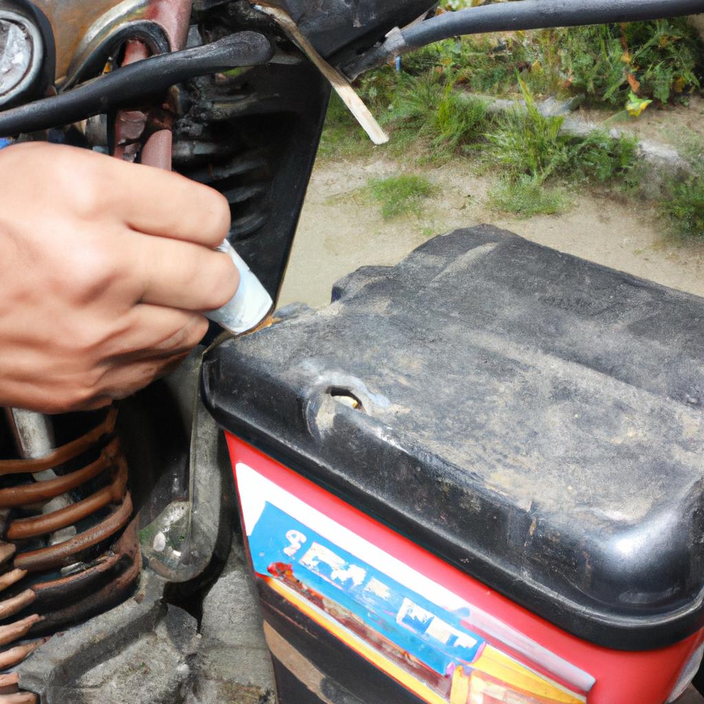 Person maintaining motorcycle battery