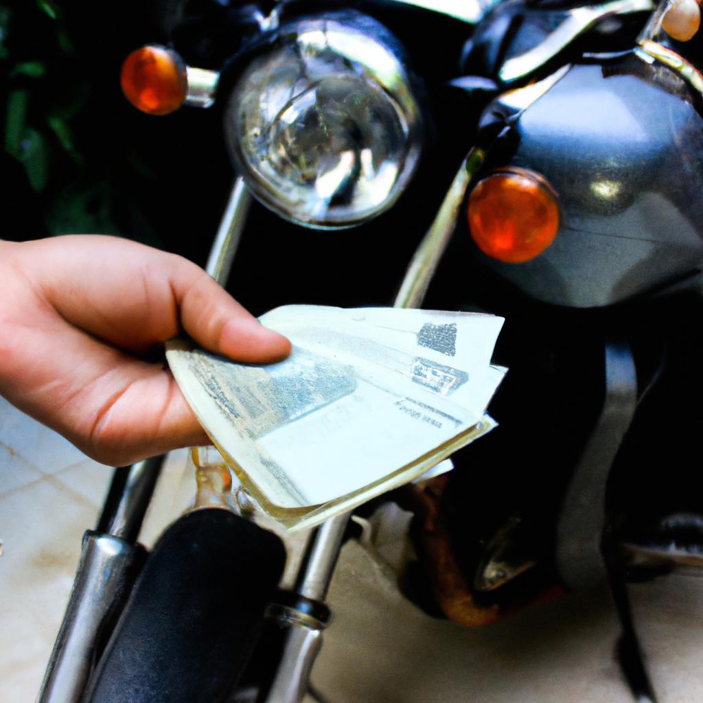 Person holding money and motorcycle