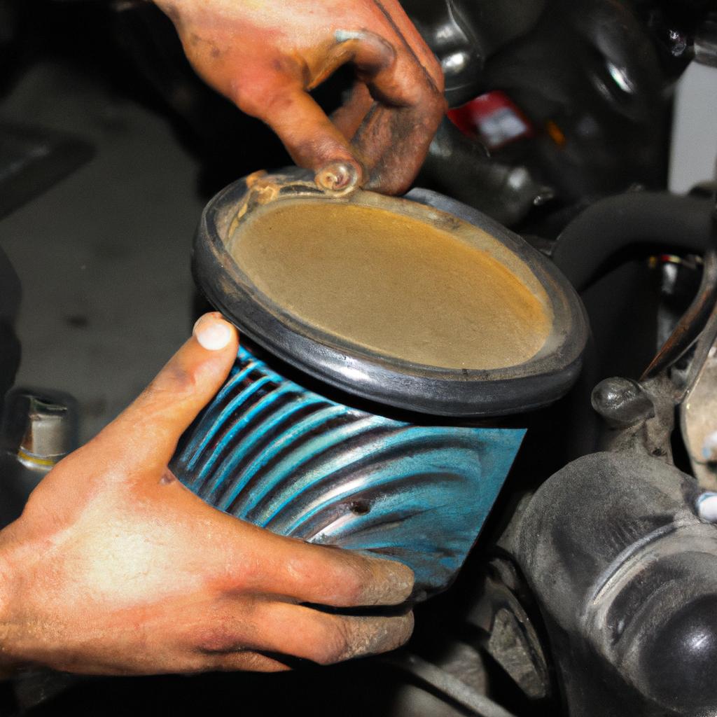 Person changing motorcycle oil filter